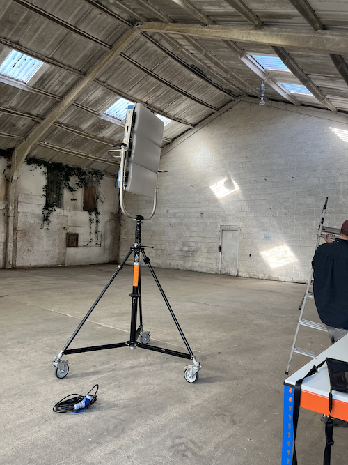 Lighting being rigged on location for Ebbon Intelligence close up of a lighting rig for a video shoot